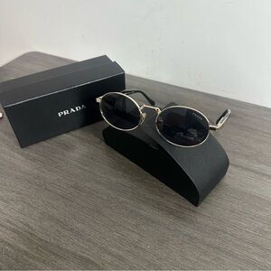 Prada Sunglasses with Black Lenses and Gold Frames